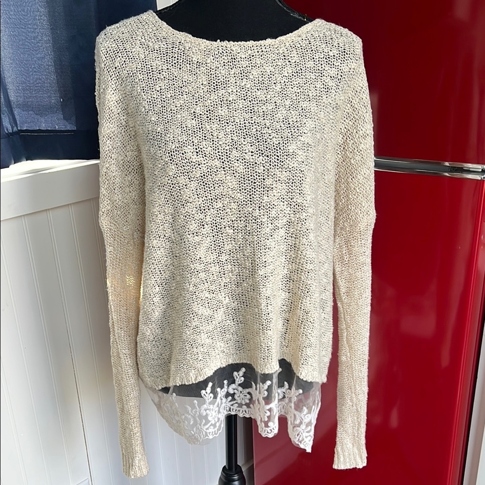 Elegant Cream Sweater with Lace Hem